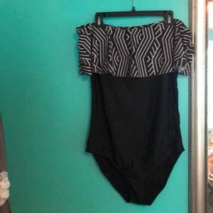 Cute off the shoulder one piece. Never been worn!